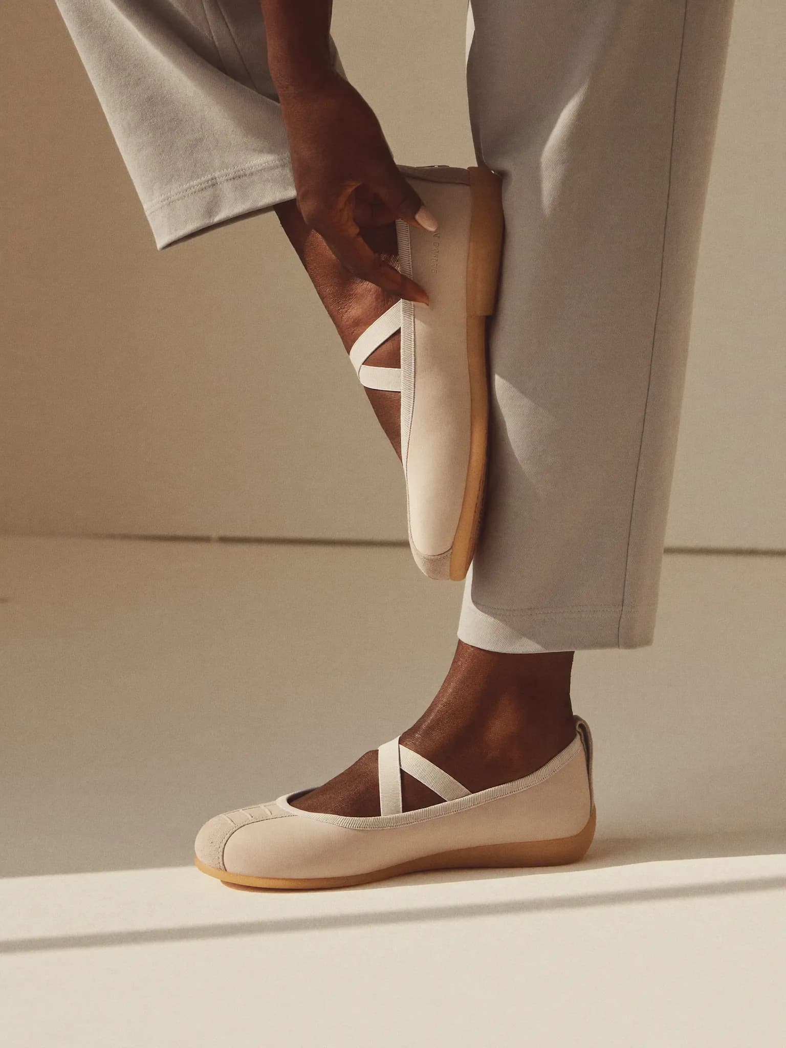 Model wearing the Bone Ballet Sneaker.