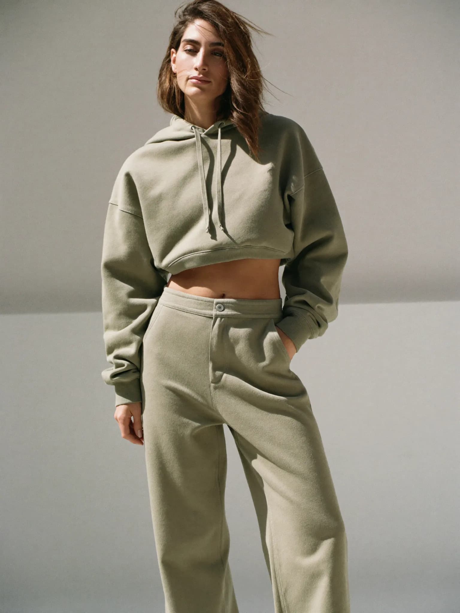Model wearing the Sage Cropped Hoodie.