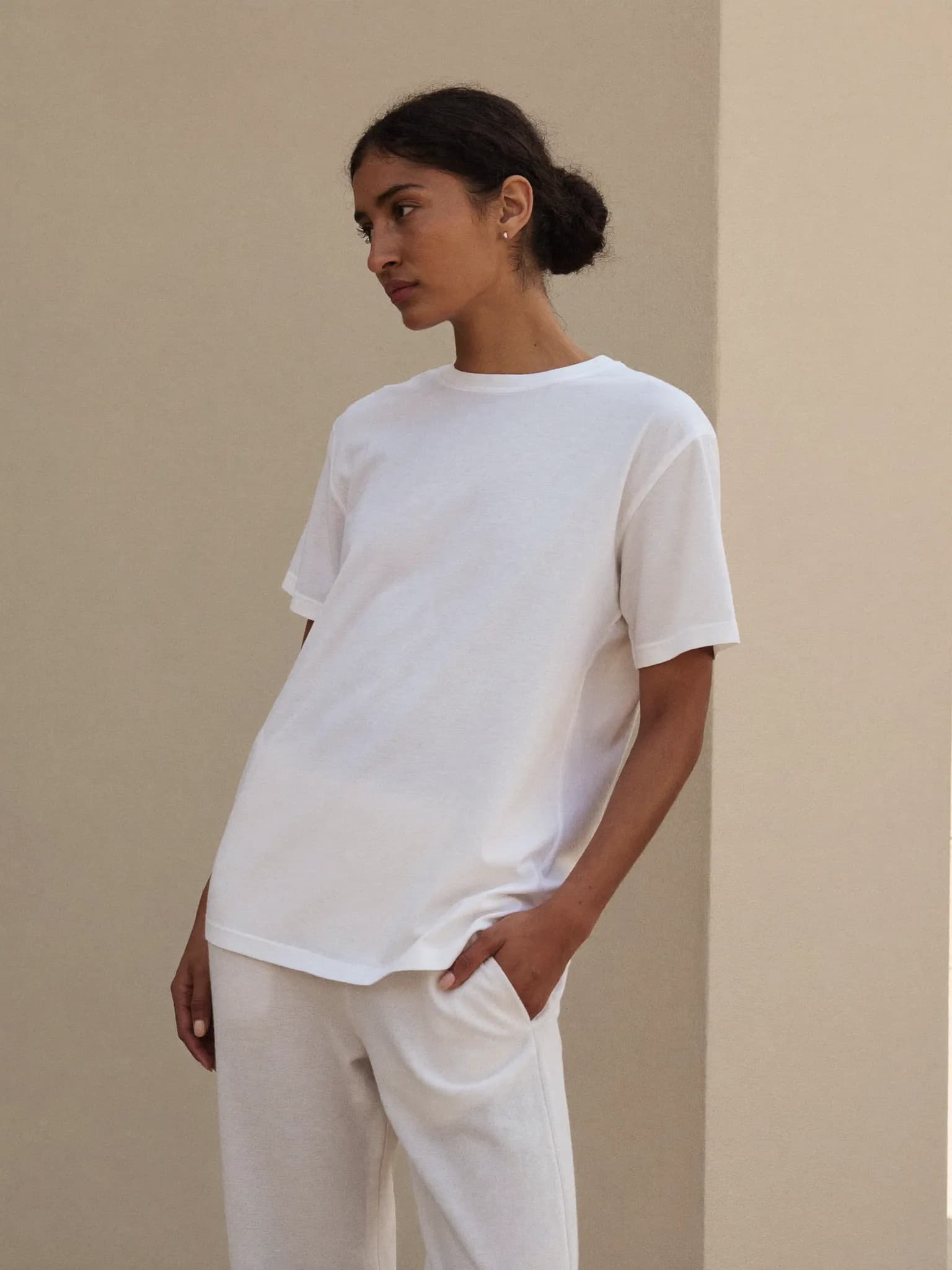 Model wearing the White Pima Cotton Crew Tee.