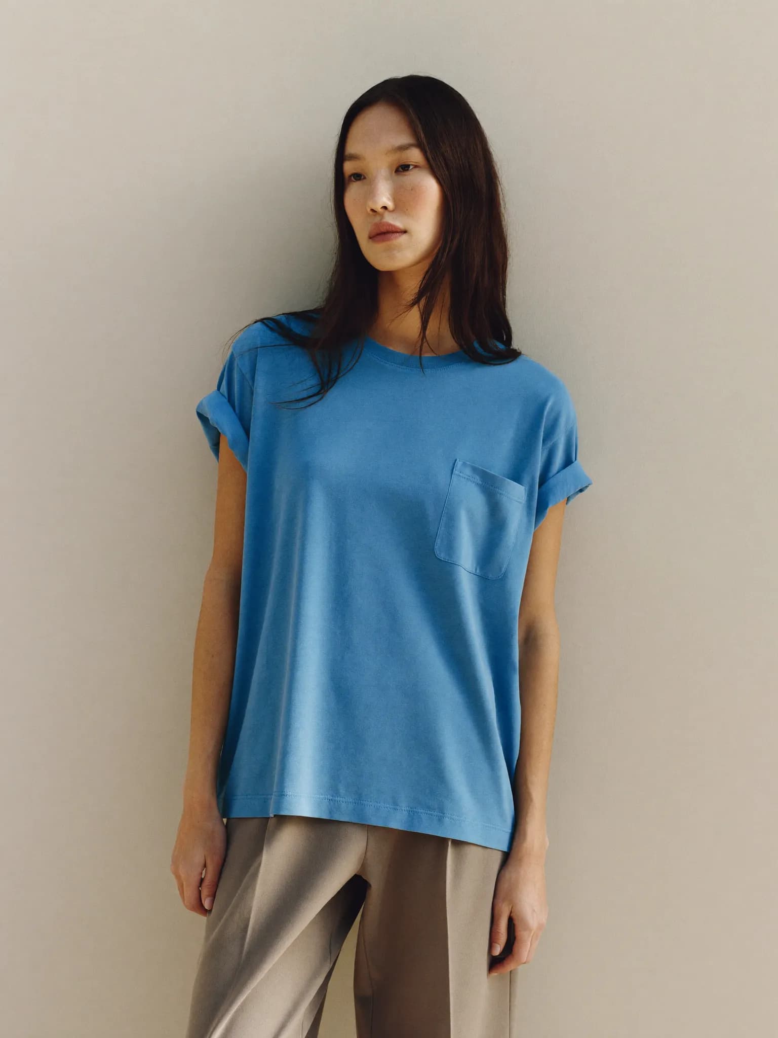 Model wearing the Sky Relaxed Pocket Tee.