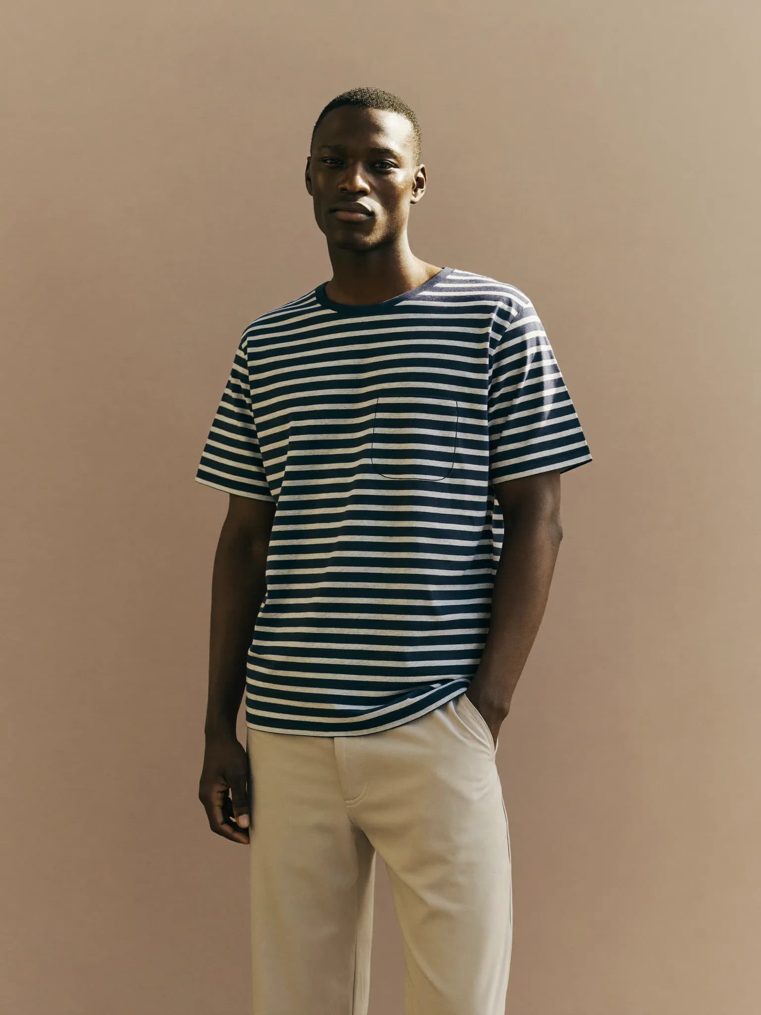 Model wearing the Navy Striped Relaxed Tee.