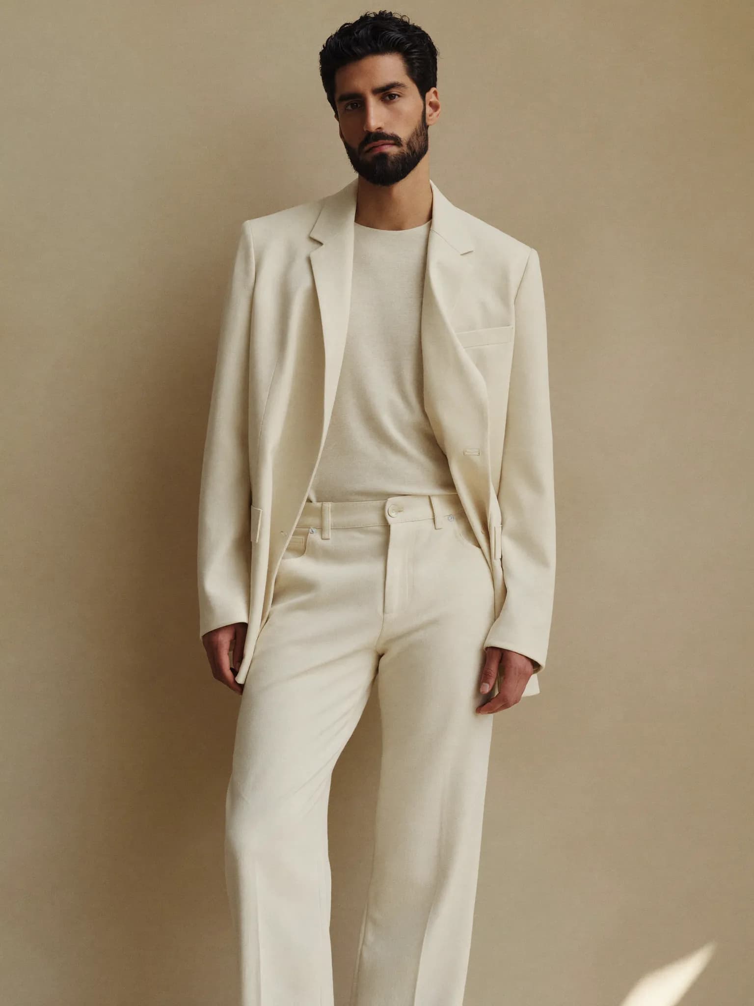 Model wearing the Ecru Tailored Trouser Jean.
